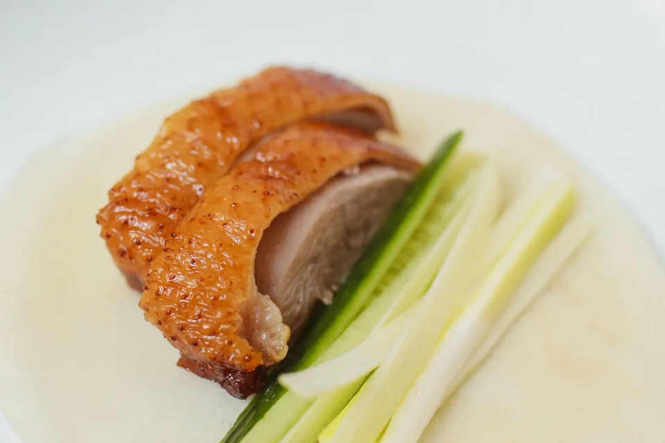 BookNoFees: Example photo: Crispy Peking duck with cucumber and spring onions on a thin pancake