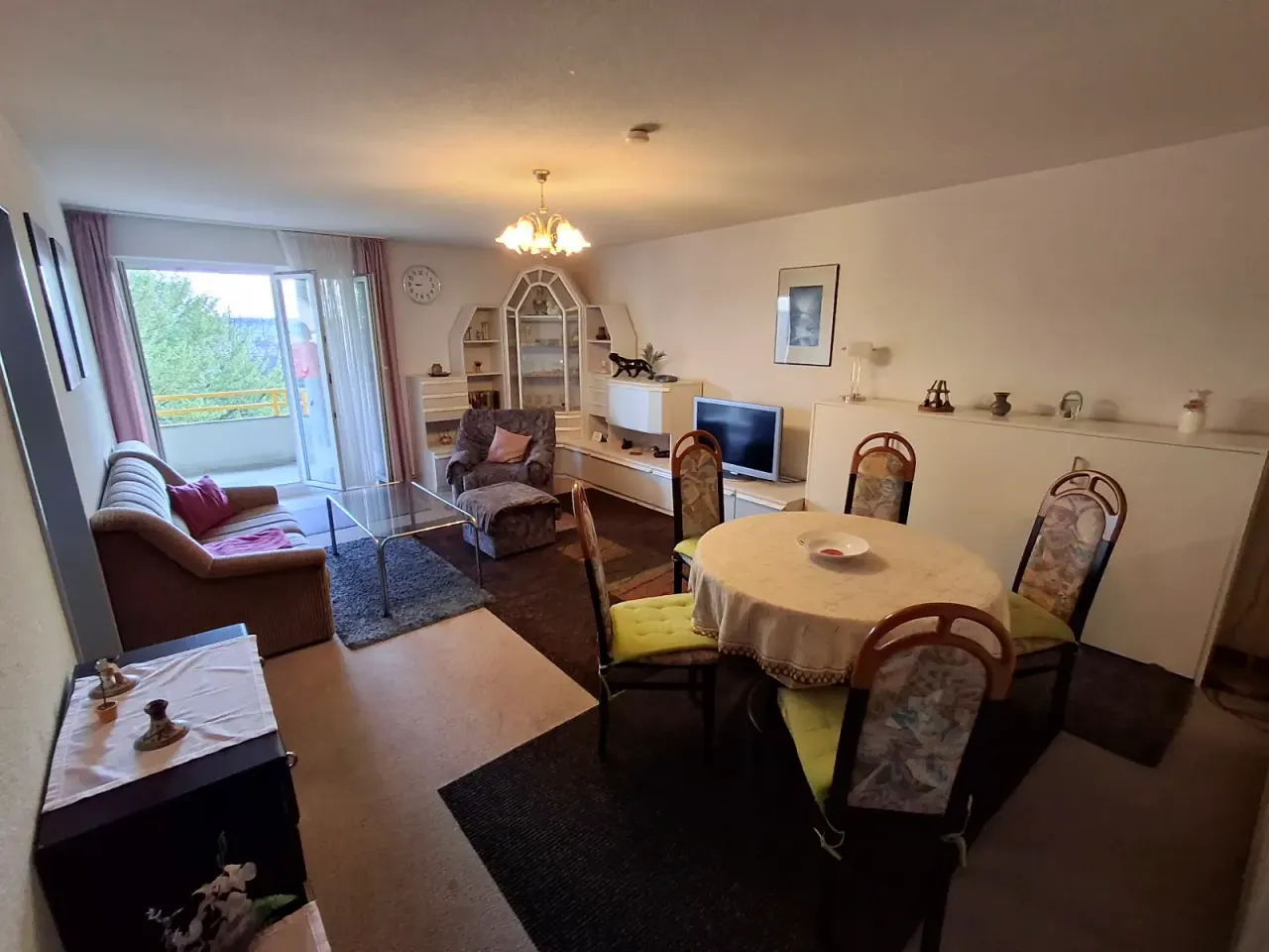 BookNoFees self catering holiday home in Gailingen, Baden-Württemberg, Germany – Living and dining area with sofa, dining table, and balcony access